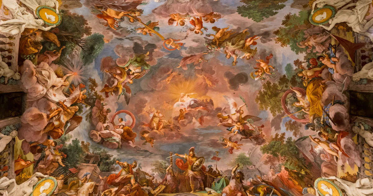 A baroque illusionistic ceiling fresco in a Roman palace, crowded with gods, horses and figures rising through painted clouds towards a burst of light at the centre.