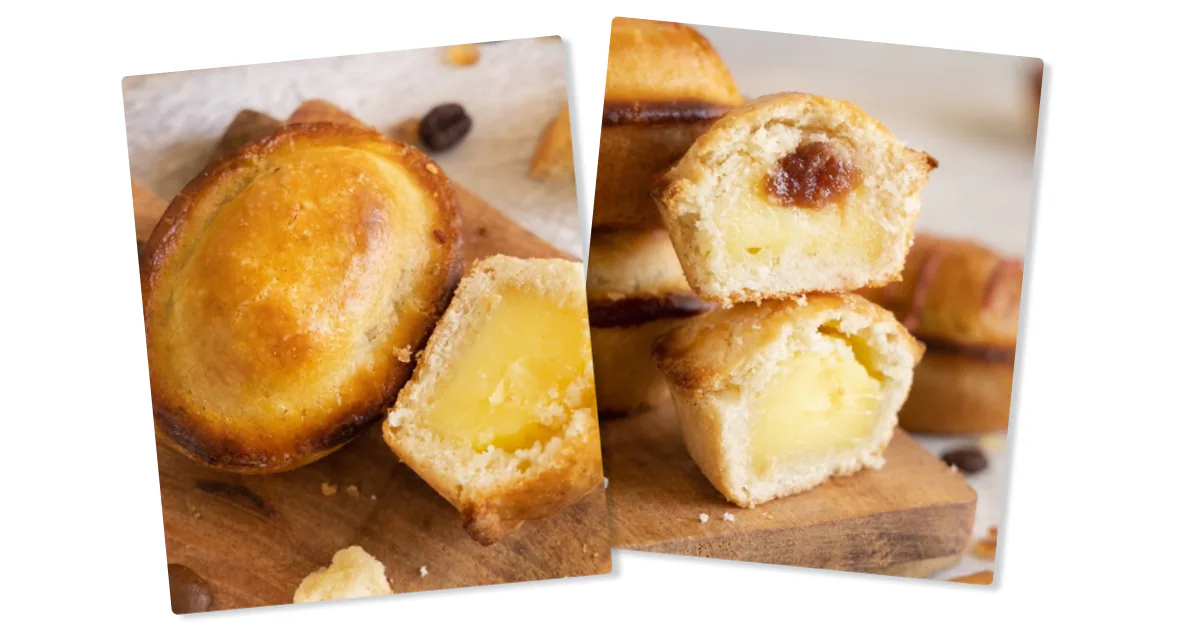 Pasticciotto leccese on a wooden board, cut open to show the warm custard filling inside the golden shortcrust pastry.